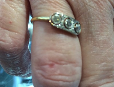 Lot 48 - A diamond three stone ring, the old cut...