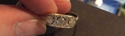 Lot 48 - A diamond three stone ring, the old cut...