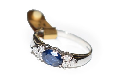 Lot 54 - A 9 carat white gold sapphire and diamond ring,...