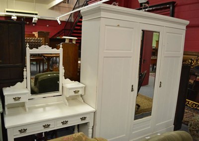 Lot 554 - White painted triple wardrobe and similar dressing table