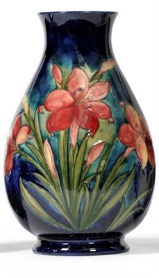 Lot 861 - A Walter Moorcroft Freesia Pattern Vase, on a blue ground, impressed factory mark, facsimile...