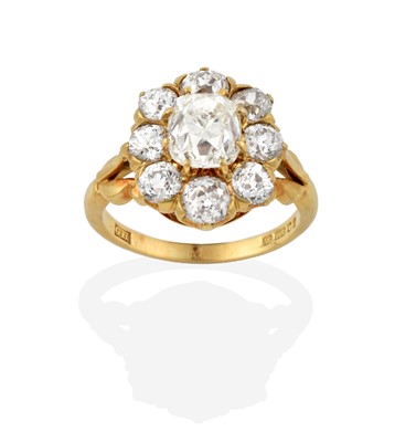 Lot 2351 - An 18 Carat Gold Diamond Cluster Ring, the old...