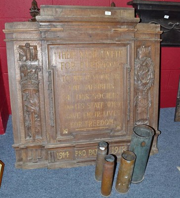 Lot 569 - Three carved oak panels commemorating fallen staff from ";The Hearts of Oak Benefit Society";,...