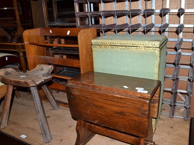 Lot 578 - A pair of limed oak single bed ends, wine rack, Lloyd Loom style laundry basket, small...