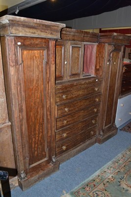 Lot 591 - A 19th century mahogany gentlemen's wardrobe enclosing five height chest of drawers (a.f.)