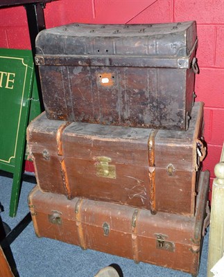 Lot 596 - Two cabins trunks and a tin trunk, a child's high chair and a painted toddler bedstead with bedding