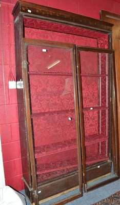 Lot 599 - Glazed mahogany two door bookcase