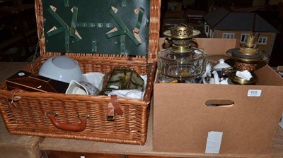 Lot 605 - A quantity including a mahogany tea caddy, two oil lamps, light fittings, a Burberrys part tea...