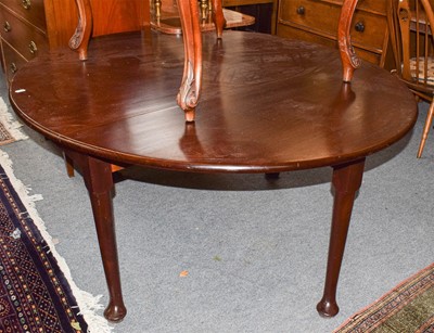 Lot 584 - A George III mahogany gateleg dining table,...