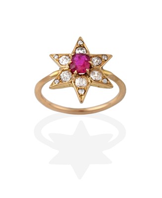 Lot 2324 - A Ruby and Diamond Cluster Ring, in a star...