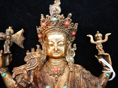 Lot 14 - A Sino-Tibetan Gilt Bronze Figure of a...