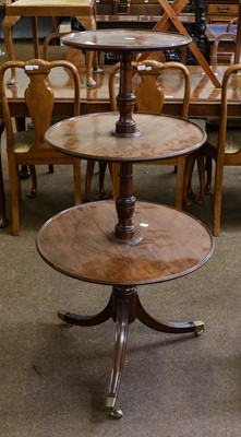 Lot 1408 - A George III mahogany three-tier dumb waiter,...