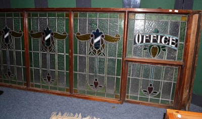 Lot 639 - Four large stained glass windows, one titled 'Office', framed as one