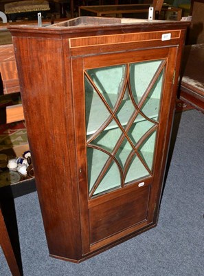 Lot 641 - Late George III mahogany hanging corner cupboard, with painted interior, 105cm high