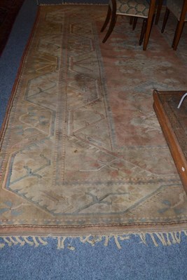 Lot 642 - Malas carpet, West Anatolia, the faded terracotta field with a column of diamond medallions...