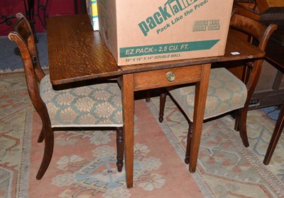 Lot 648 - A 19th century oak Pembroke table and two late Georgian chairs