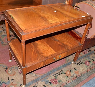 Lot 653 - A reproduction crossbanded mahogany tea trolley with single drawer and serving tray