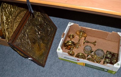 Lot 670 - A collection of assorted brassware including four plaques, an Indian plaque, candlesticks, etc