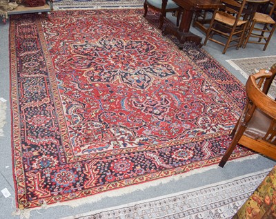 Lot 347 - A Heriz carpet, the blood red field with...
