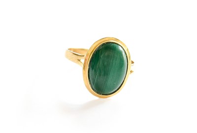 Lot 40 - A Malachite Ring, stamped '18K750', finger size P
