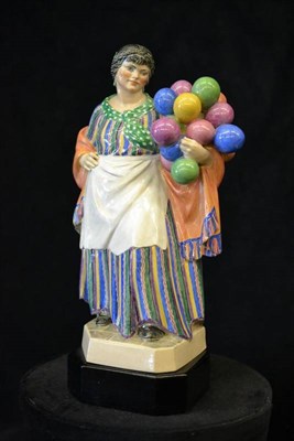 Lot 875 - A Chelsea Pottery Group  "The Balloon Woman ", by Charles Vyse, modelled as a woman holding...