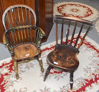 Lot 1208 - A child's windsor armchair with green staining...