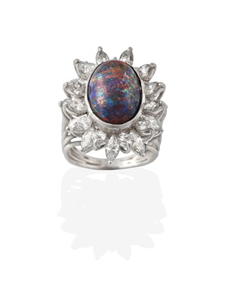 Lot 2321 - A Black Opal and Diamond Cluster Ring, the...