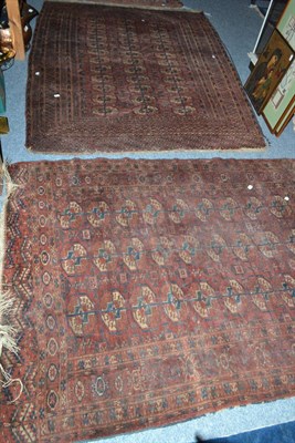 Lot 713 - Tekke rug, Emirate of Bukhara, the deep madder field with three columns of guls enclosed by...