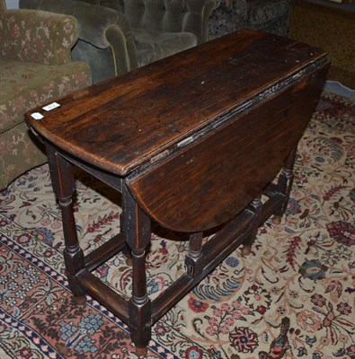 Lot 714 - An 18th century oak gate leg table (a.f.)