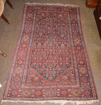 Lot 1239 - A Feraghan rug, the lozenge of Herati design...