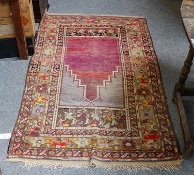 Lot 1103 - Anatolian prayer rug, the stepped abrashe...