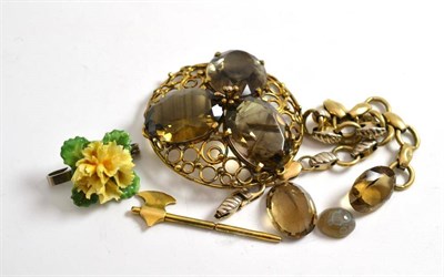 Lot 7 - A two colour bracelet stamped '375', an axe, a smokey quartz brooch, gemstones and a porcelain...
