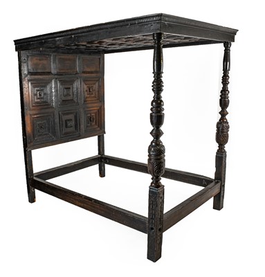 Lot 762 - A Panelled Oak Bedstead, the canopy top with...