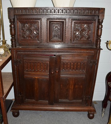 Lot 1192 - A 17th century oak court cupboard with foliate...