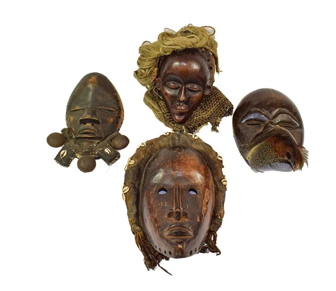 Lot 275 - Four Dan Carved Wood Masks, Ivory Coast, one...
