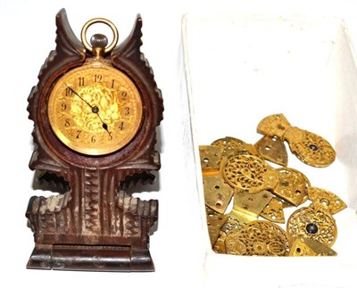 Lot 14 - An 18ct gold fob watch, a carved wooden pocket watch stand and fourteen cook balances