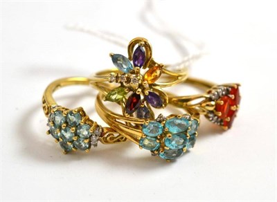 Lot 17 - Four 9ct gold rings set with diamonds and assorted gemstones including tourmaline
