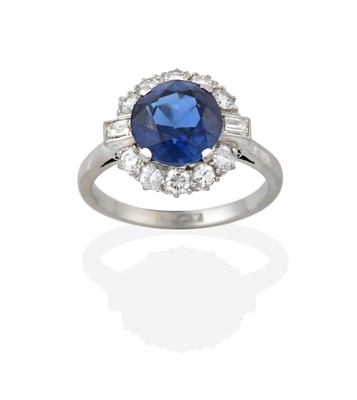 Lot 2346 - A Sapphire and Diamond Cluster Ring, the round...