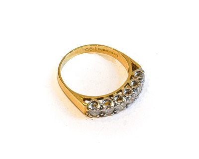 Lot 155 - An 18 carat gold diamond six stone ring, the...