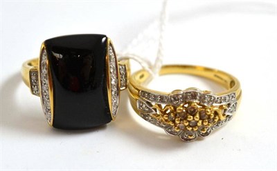 Lot 26 - A 9ct gold diamond cluster ring and an onyx ring