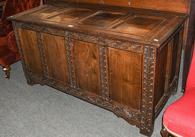 Lot 567 - An 18th century oak four panelled coffer with...