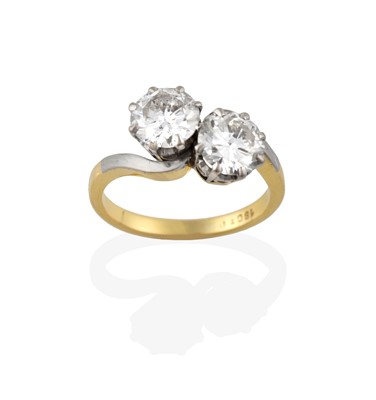 Lot 2320 - A Diamond Two Stone Twist Ring, the round...