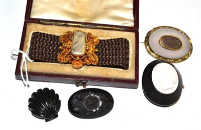 Lot 46 - A mourning bracelet (cased), a mourning brooch and three jet brooches