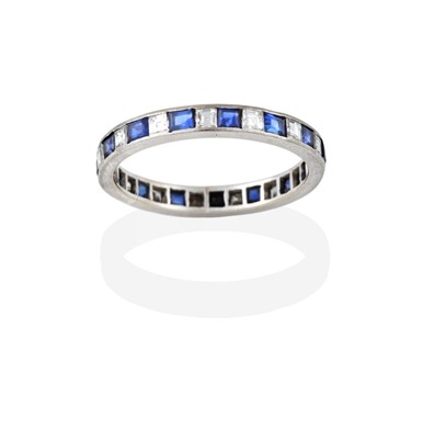 Lot 2391 - A Sapphire and Diamond Eternity Ring, fifteen...