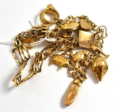 Lot 51 - A charm bracelet hung with nine charms and a 9ct gold gate bracelet