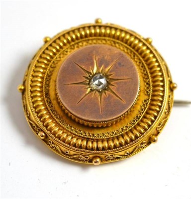 Lot 54 - A Victorian locket back brooch inset with a rose cut diamond