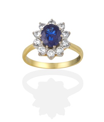 Lot 2303 - An 18 Carat Gold Sapphire and Diamond Cluster Ring