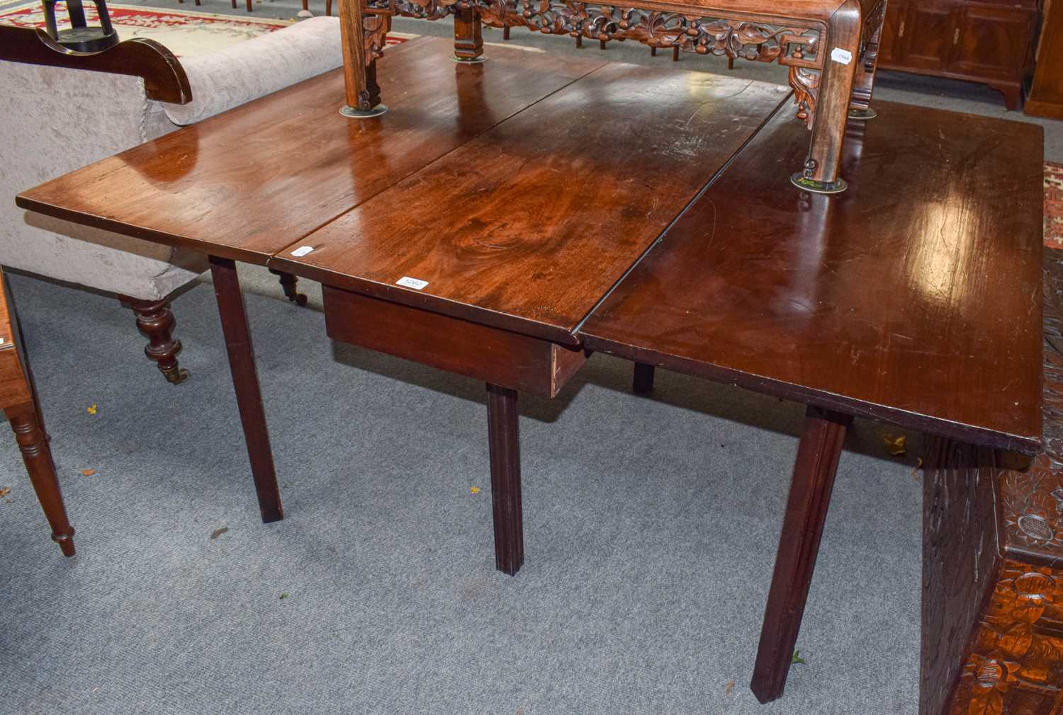 Lot 1262 - A 19th century mahogany gateleg dining table,...