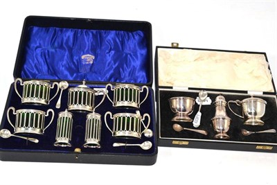 Lot 67 - Two cased cruet sets plus an extra spoon