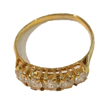 Lot 257 - An 18 carat gold diamond five stone ring, the...